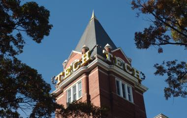 Tech Tower on Georgia Tech's campus set against a blue sky.