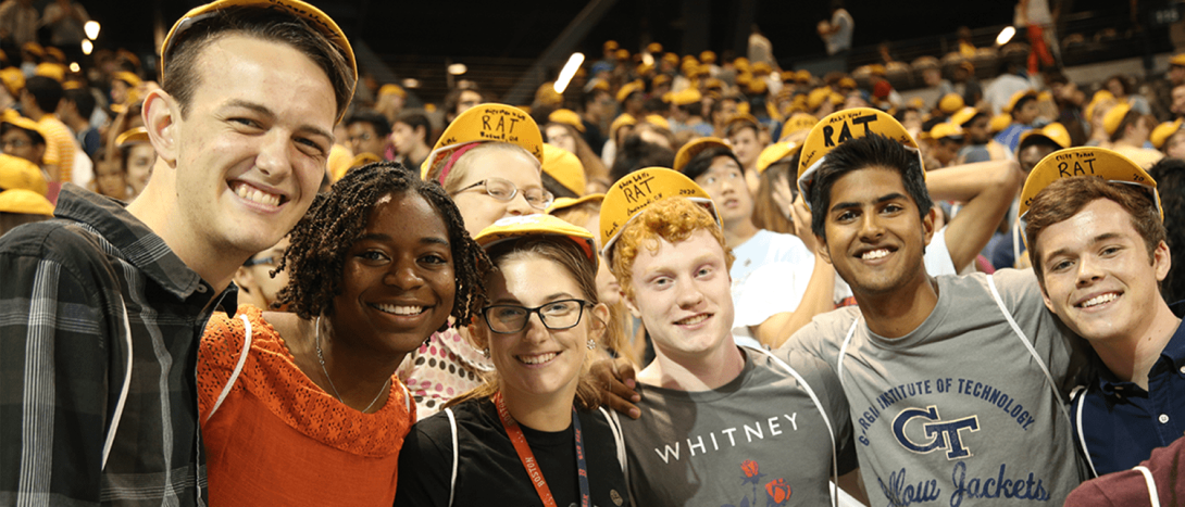 students in caps smiling