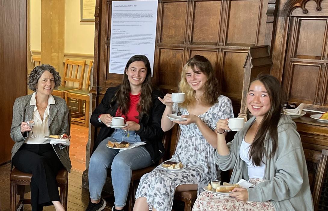 Shannon at Oxford having tea with students